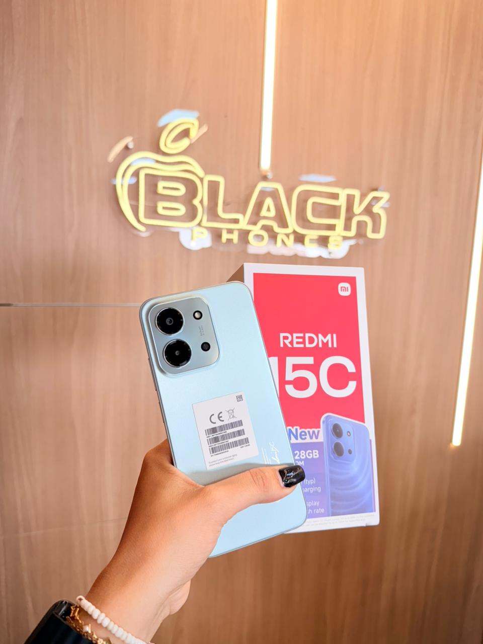 Smartphone Redmi 15C azul com sua caixa na Black Phones